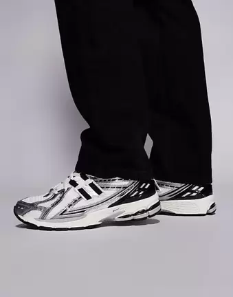 New Balance 1906 unisex trainers in white and silver