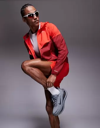 Nike Running Vomero Plus trainers in grey and orange