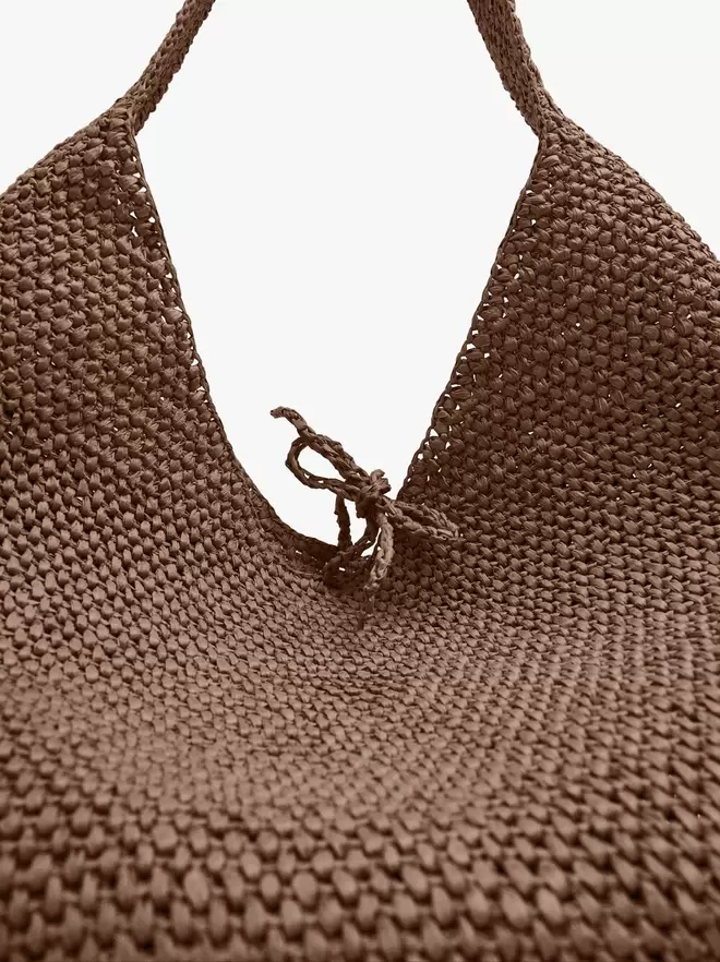 Shoulder bag with straw effect