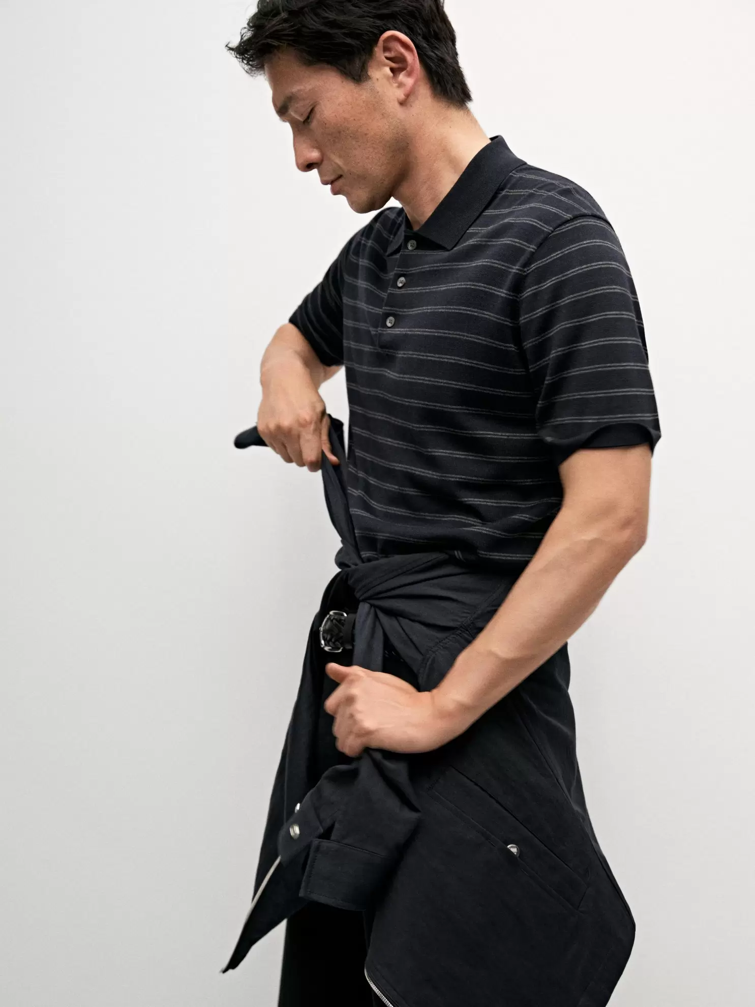 Cotton blend knit polo shirt with striped detail