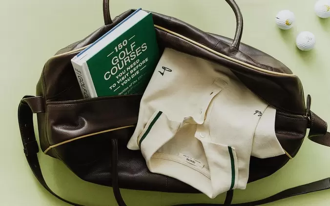 GOLF POLO SHIRT, LEATHER BAG, BOOK AND BALLS