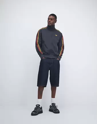 adidas Originals Firebird track top in black and gold