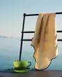 COFFEE CUP, FORGED METAL CHAIR AND NAPKIN