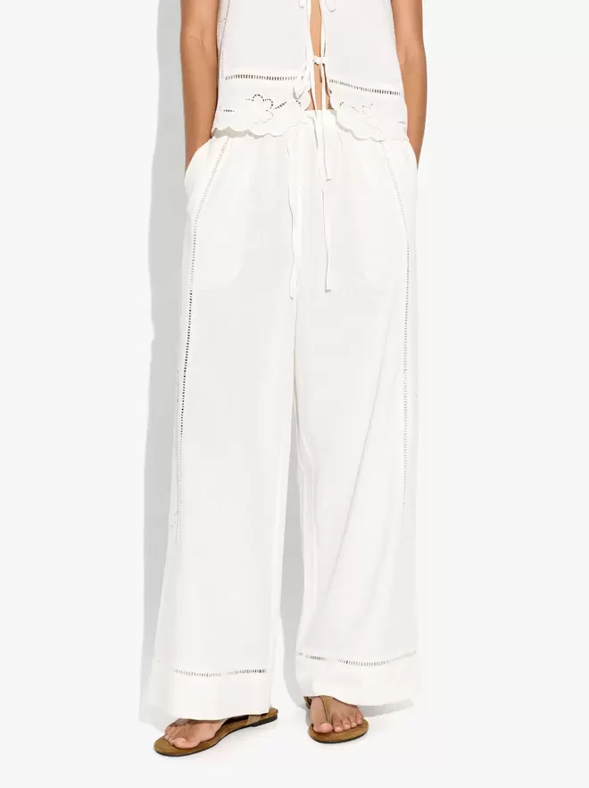 Trousers with perforated embroidery linen blend