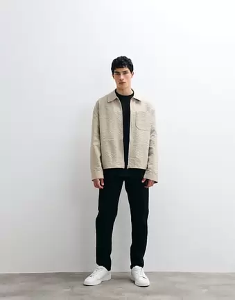 ASOS DESIGN tapered jeans in black