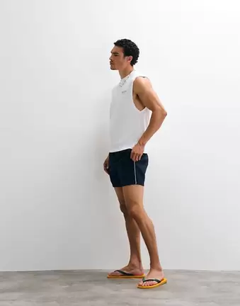 ASOS DESIGN wide mid length elasticated nylon short with piping styling in navy