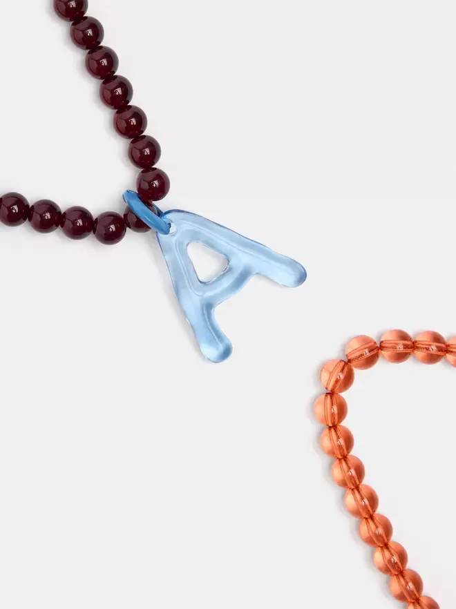 Set of beaded necklaces with a letter A pendant