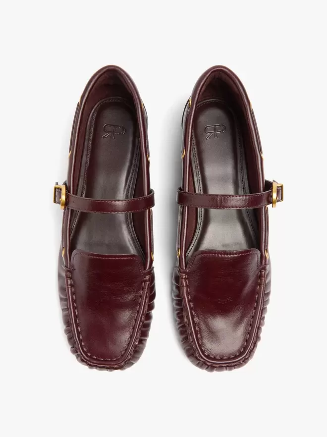 Leather moccasins with strap and buckle