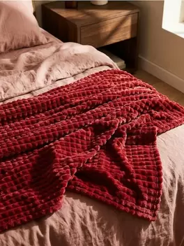 Takaró dombornyomott mintával