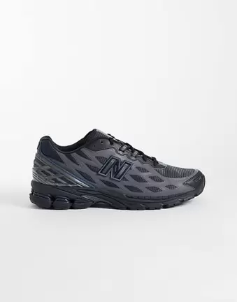 New Balance 1906 trainers in black and blue