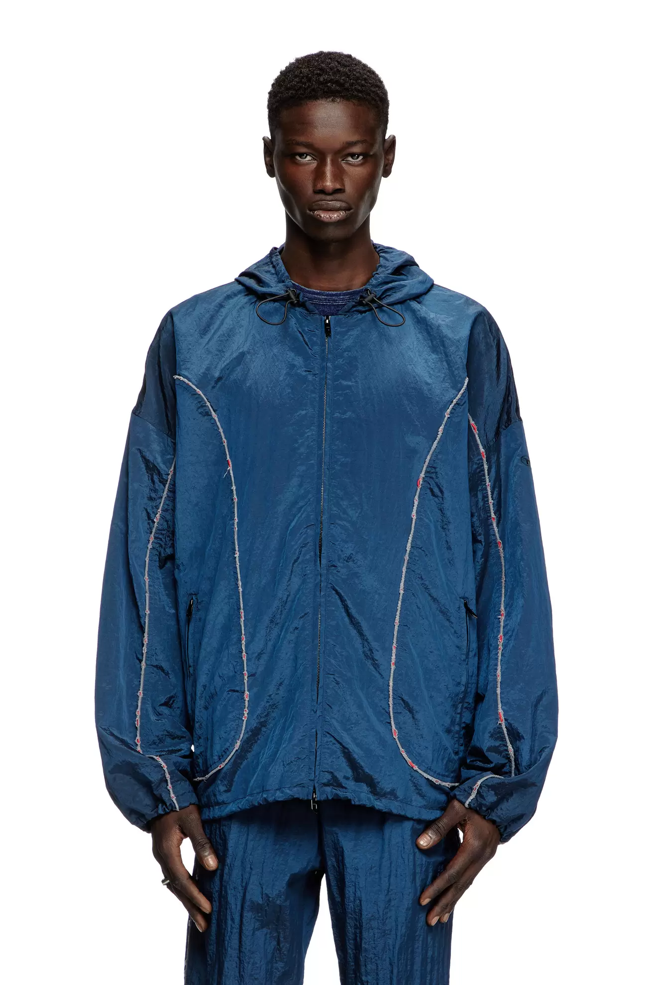 Windbreaker with destroyed piping