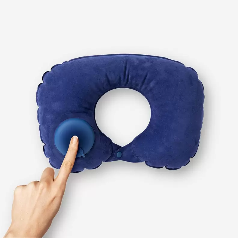 Inflatable travel pillow in drawstring bag