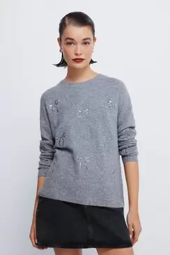 Pull avec nœuds à paillettes