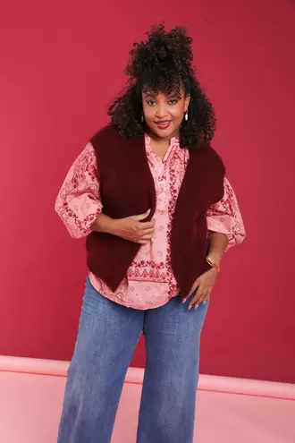 Effen mouwloos gilet €39,99