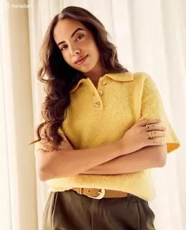 Pull avec des boutons dorés