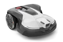 Robotic lawn mower with a visible control panel and large wheel, shown in a studio setting.