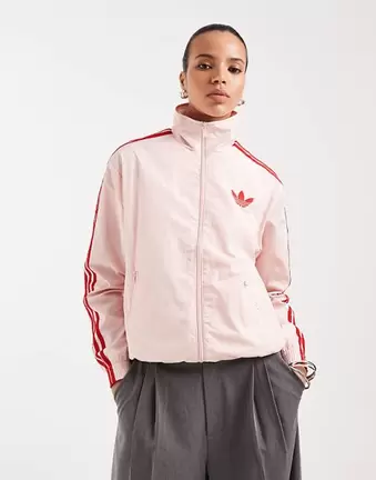 Adidas Originals Firebird loose nylon track top in pink and red
