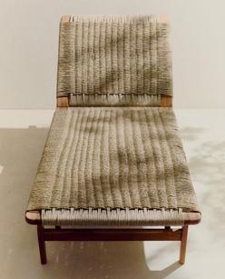 TEAK OUTDOOR LOUNGER  COFFEE TABLE WITH A CONICAL BASE  FOLDING CHAIR WITH WOVEN TEAK EXTERIOR