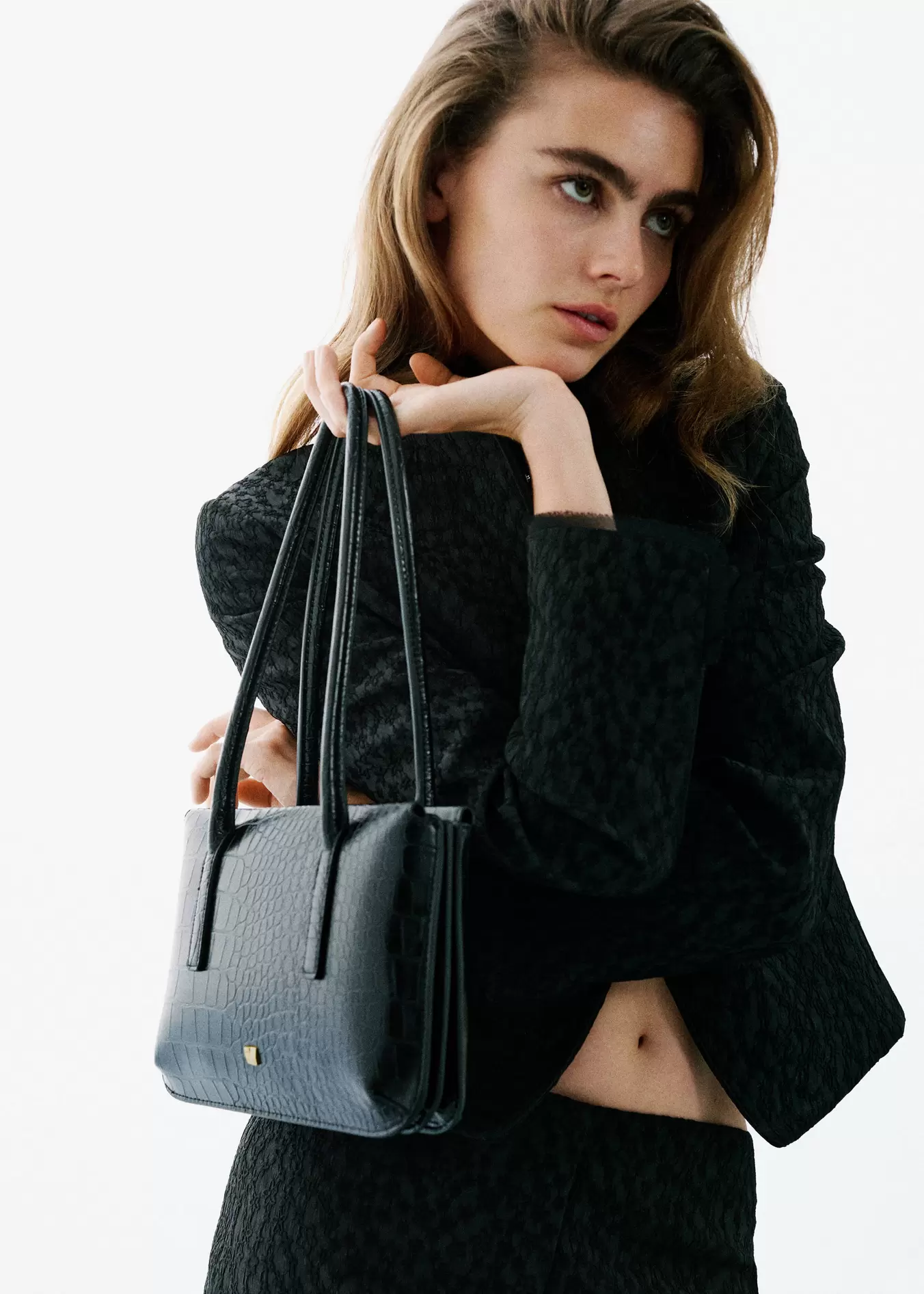 Black textured jacket worn with a matching shoulder bag., Black. Ref: 37029404-00.