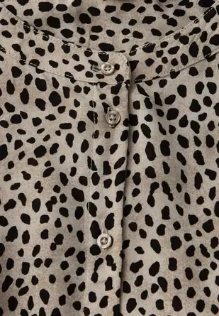 Leo blouse met taping details