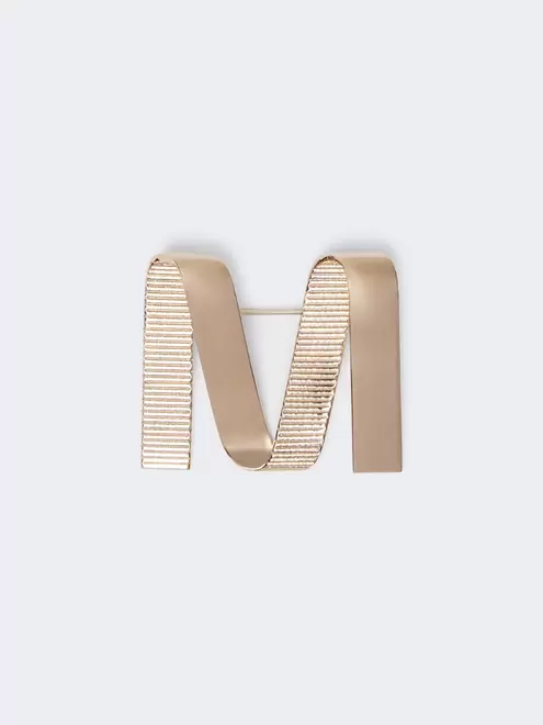 Metallic M brooch