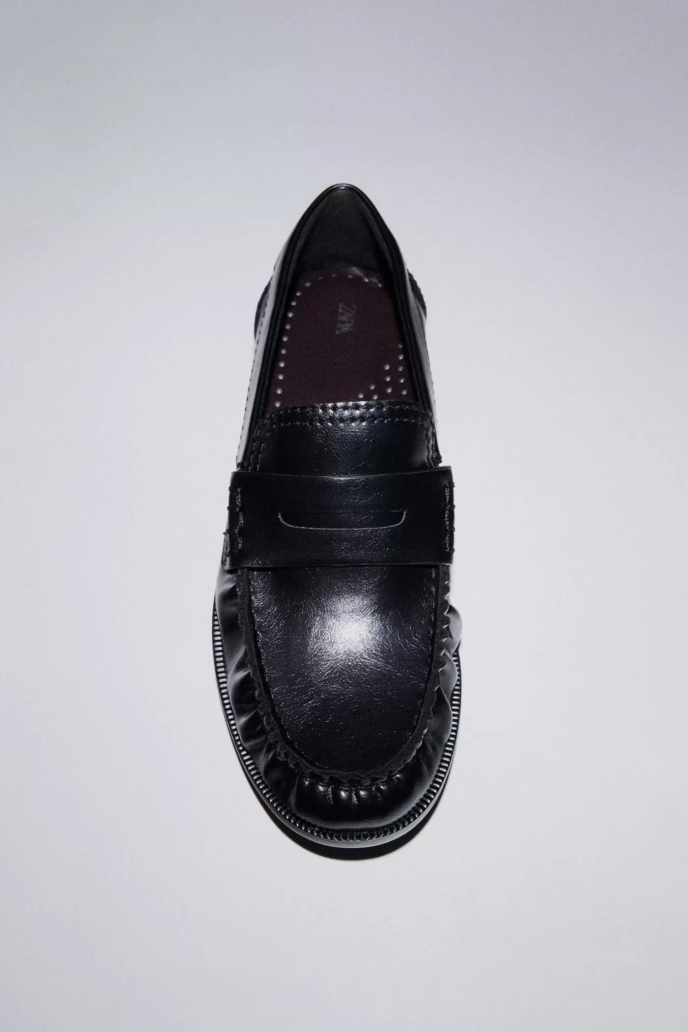 PLATTE MOCASSINS MET PLOOIEN