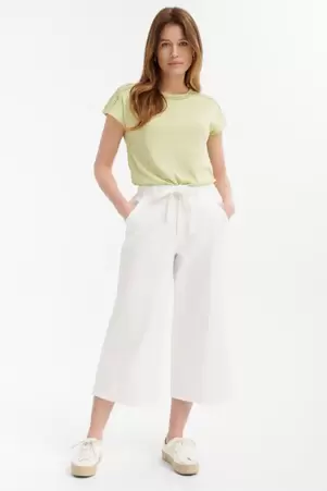 Kremowe spodnie typu culotte