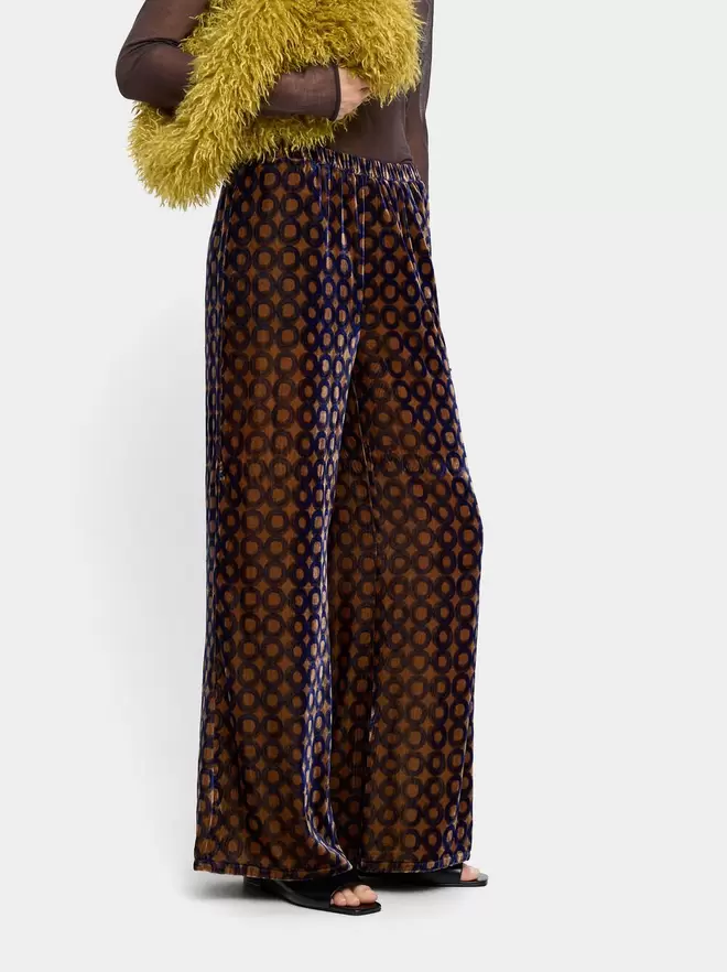 Velvet trousers with printed circles
