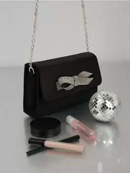 Mała torebka na łańcuszku z kokardą