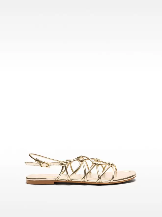 Flat sandals with crossed straps and knots