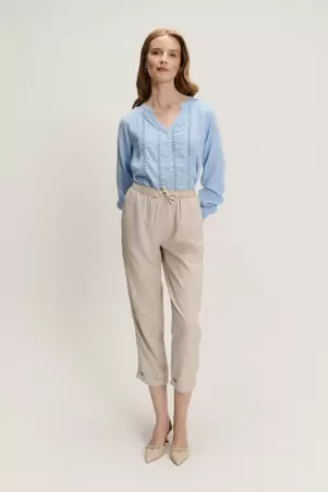 Beżowe spodnie z nogawką o długości 7/8