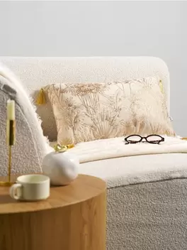 Poduszka dekoracyjna z motywem roślinnym i frędzlami