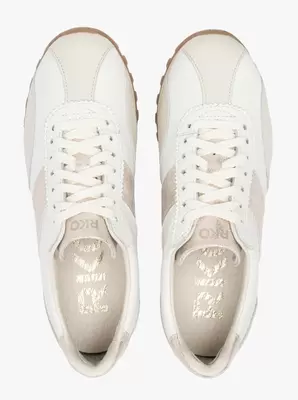 Kremowe buty sportowe ze złotym paskiem
