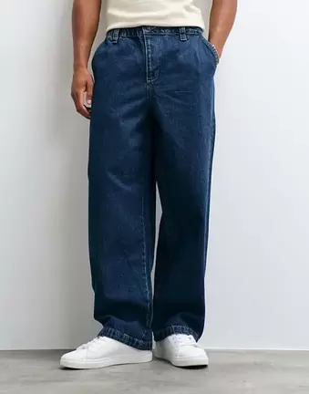 ASOS DESIGN luźne jeansy o prostym kroju w średnim odcieniu niebieskiego z elastyczną talią