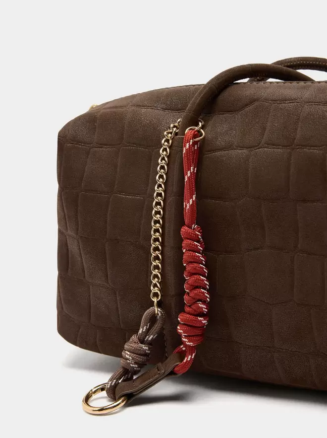 Shoulder bag with animal embossing