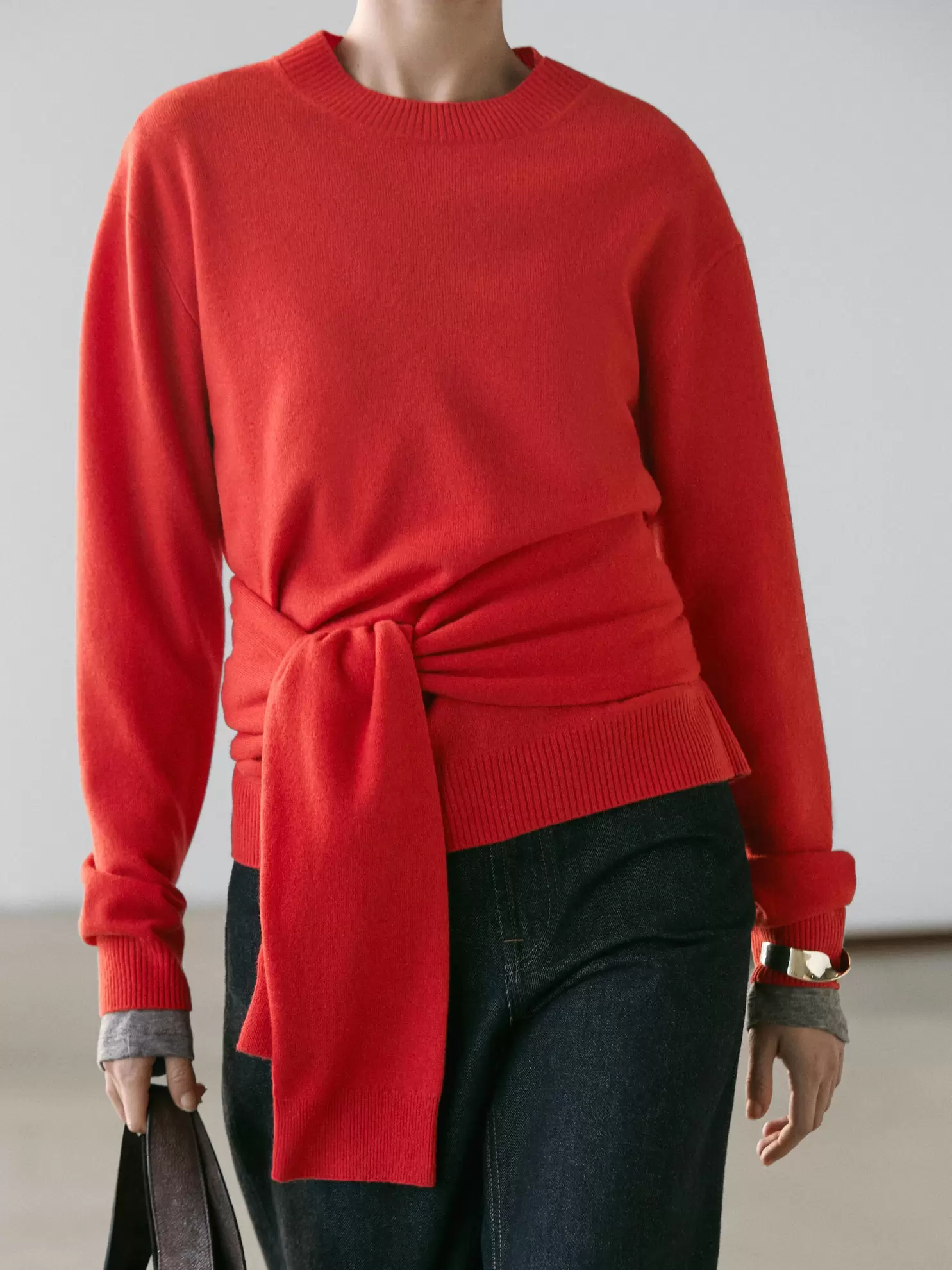 Wool knit sweater with waist detail