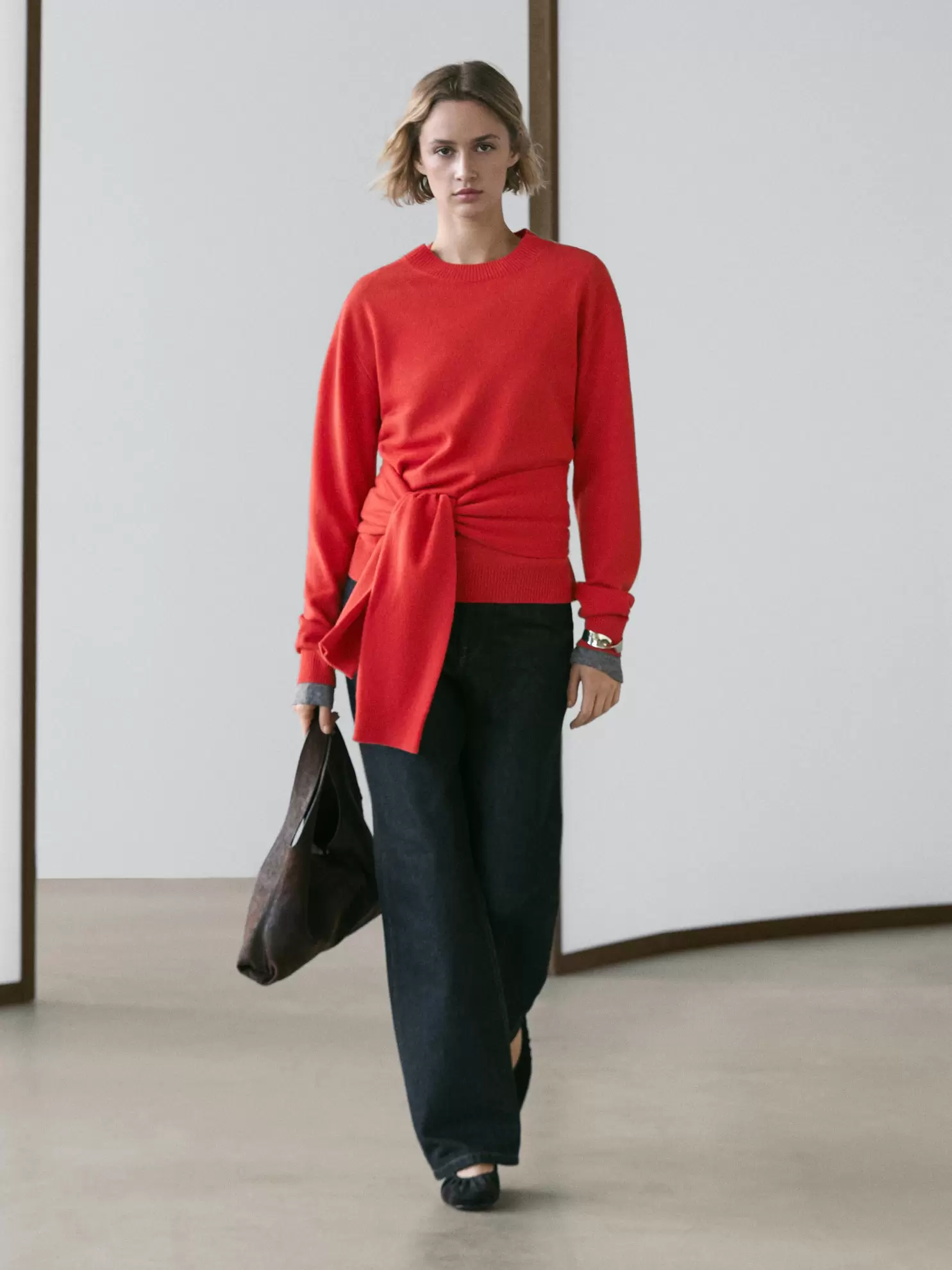 Wool knit sweater with waist detail