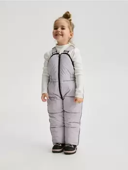 Pantaloni cauciucați cu bretele