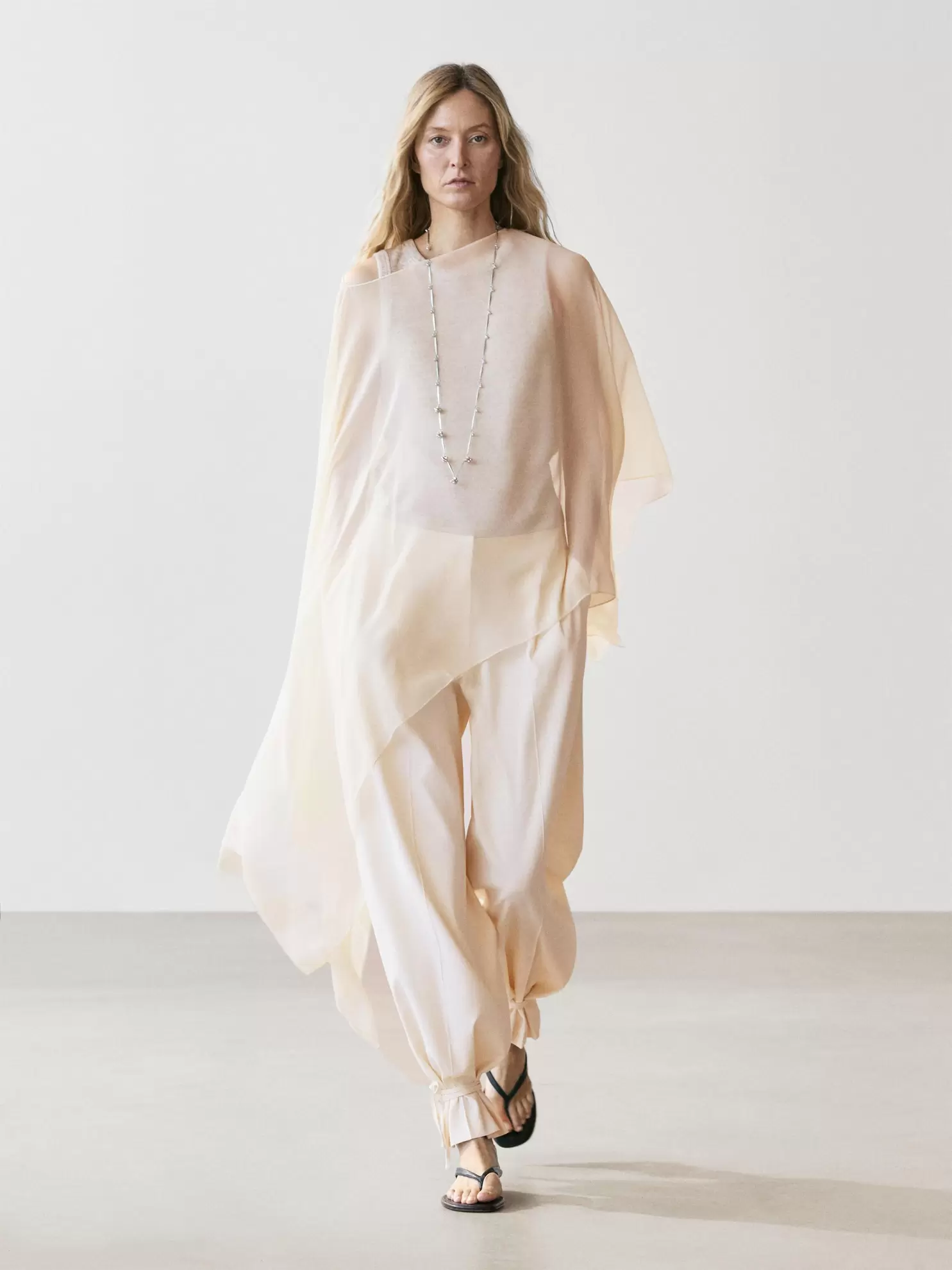 Asymmetric cut silk cape