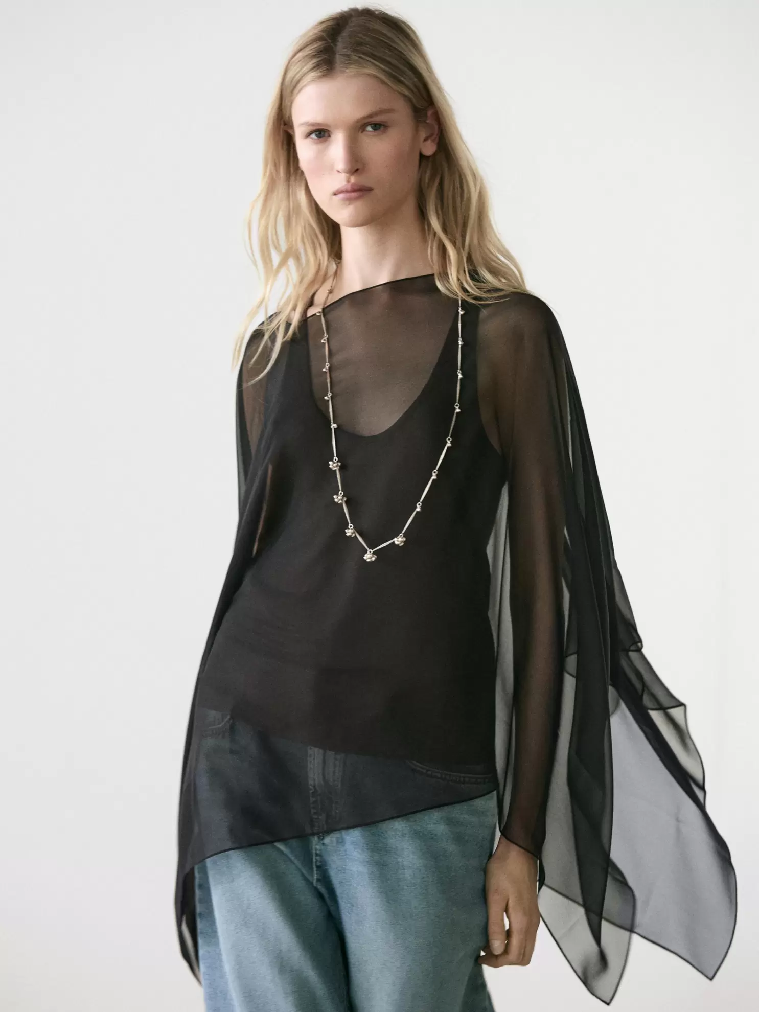 Asymmetric cut silk cape