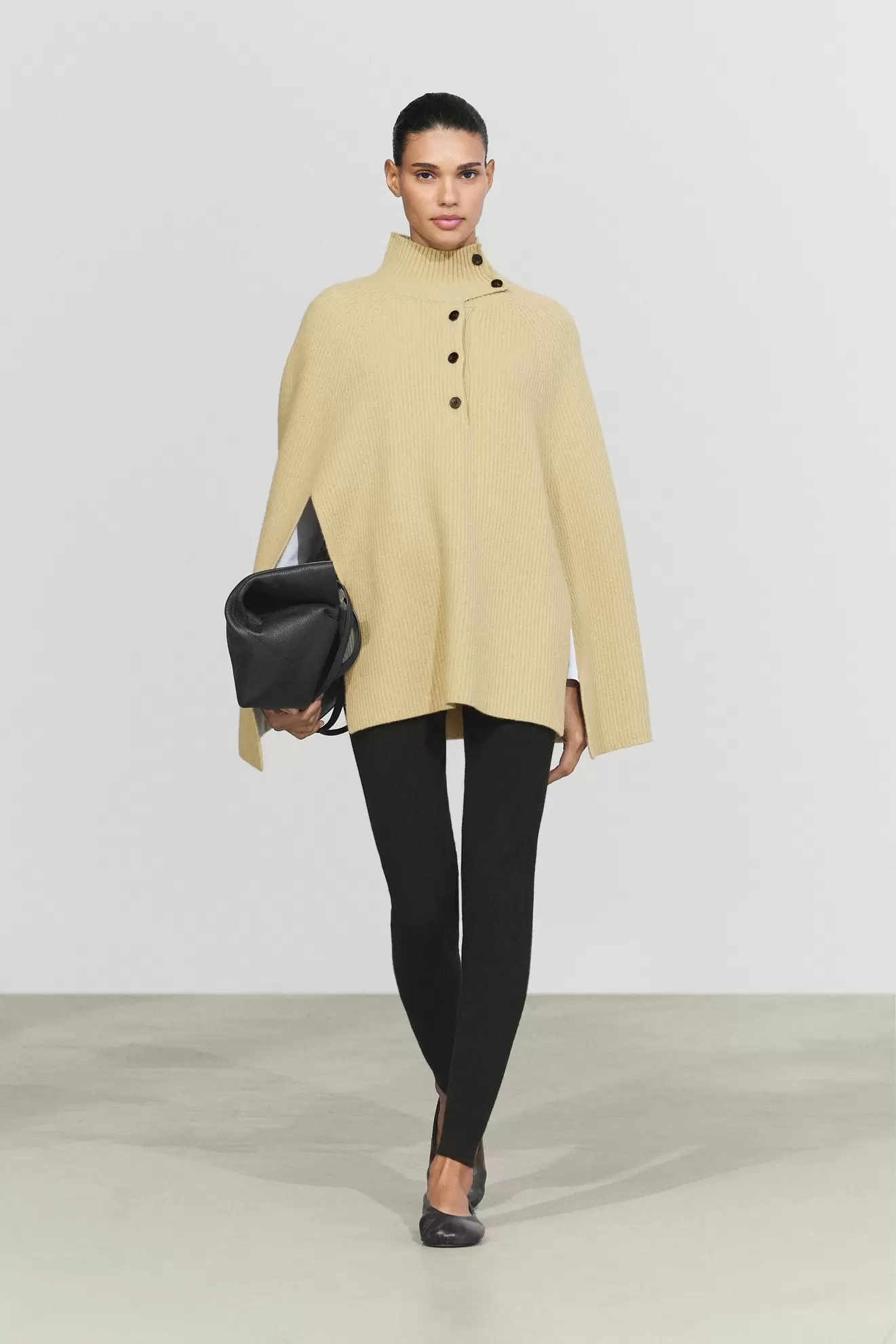 100% wool knit cape with button detail