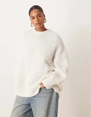 ASOS DESIGN Curve oversized boucle jumper with curved hem in cream